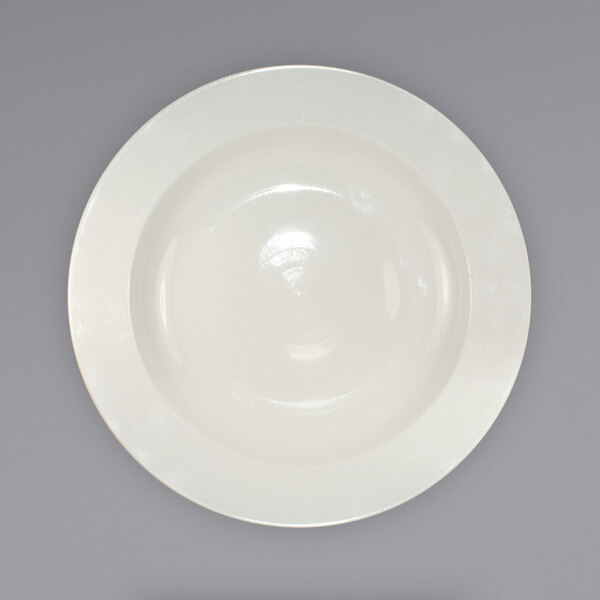 An International Tableware ivory stoneware pasta bowl with a rolled edge on a white background.