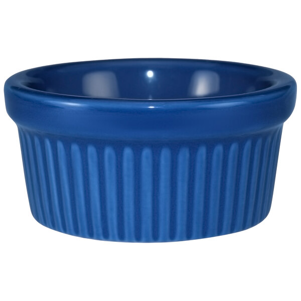 A light blue fluted stoneware ramekin.