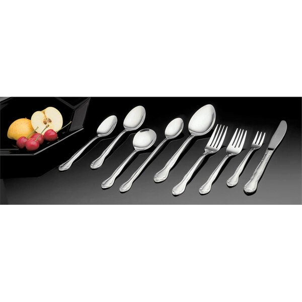 A close-up of a Vollrath stainless steel spoon and fork.