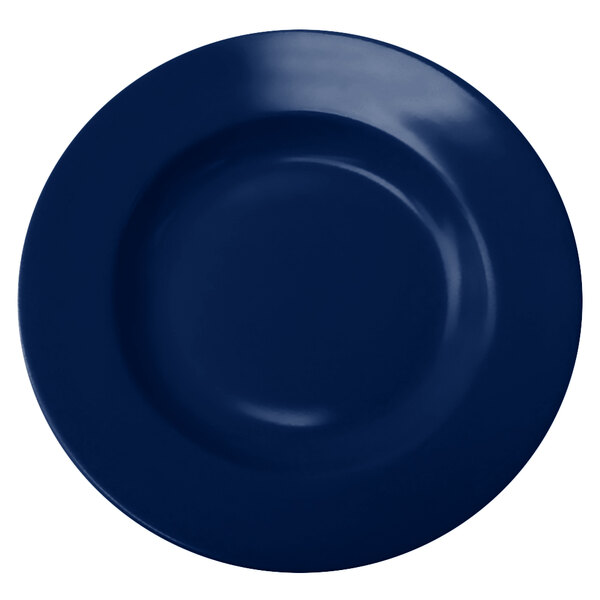 A cobalt blue stoneware bowl with a white background.