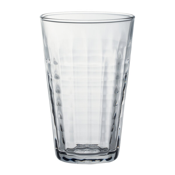 A clear glass tumbler with a textured pattern.