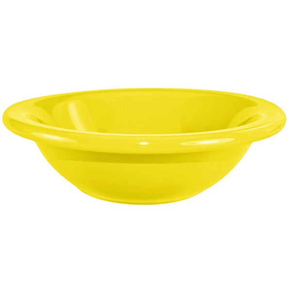 A close up of a yellow International Tableware stoneware bowl.