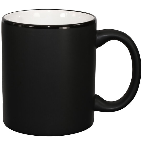 a black mug with a white rim