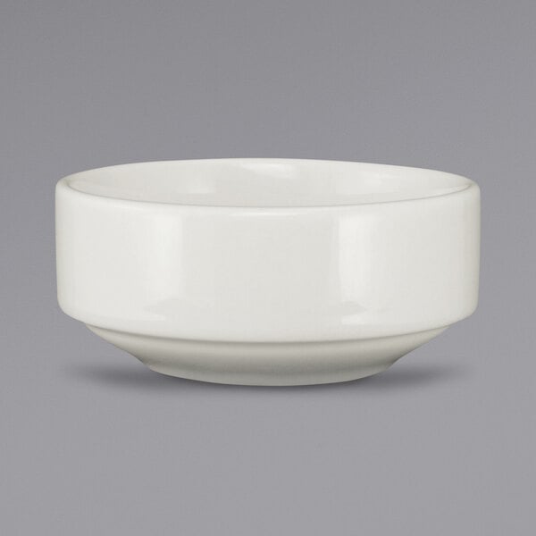 An ivory stoneware ramekin with a small rim on a white background.