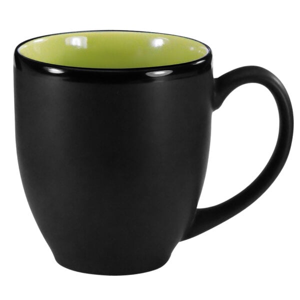 A black stoneware bistro cup with a lime green rim.