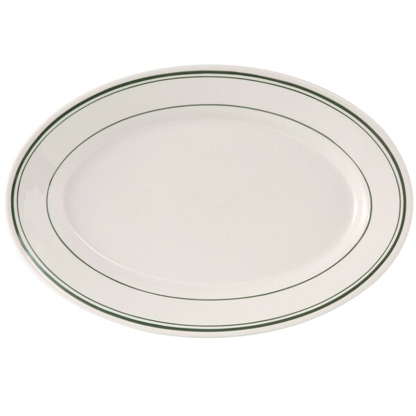 A white oval china platter with green bands.