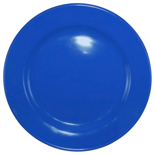 A light blue International Tableware stoneware plate with a wide rim and rolled edge.