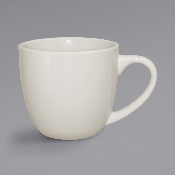 A close-up of a white International Tableware Roma cappuccino mug with a handle.