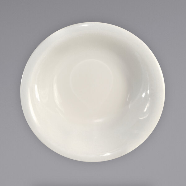 An International Tableware Valencia stoneware fruit bowl with a white rim on a white surface.