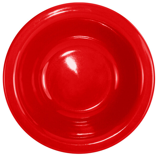 A crimson red stoneware grapefruit bowl with a white background