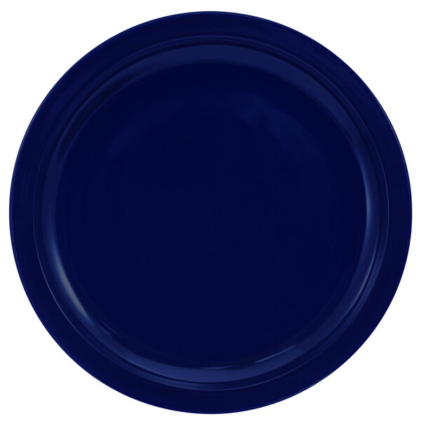 A cobalt blue stoneware plate with a narrow rim.