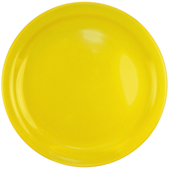 a close up of a yellow plate