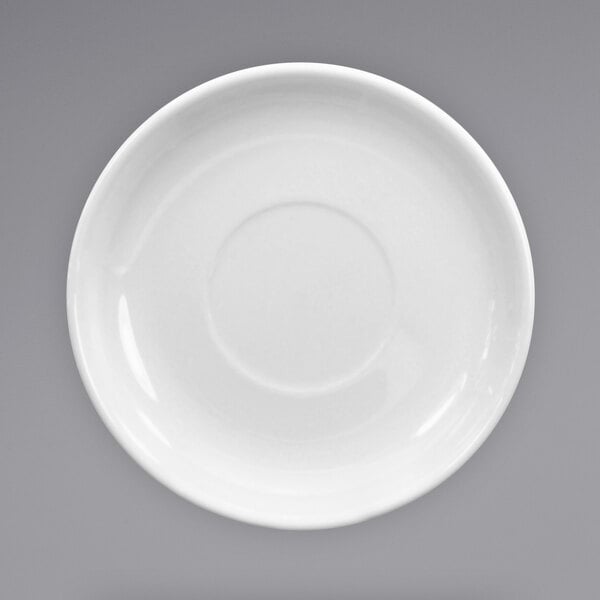 An International Tableware European white stoneware saucer with a rim.