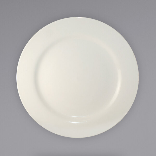 An ivory stoneware plate with a wide, circular rim.