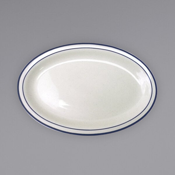 An International Tableware Danube ivory platter with blue bands on the rim.