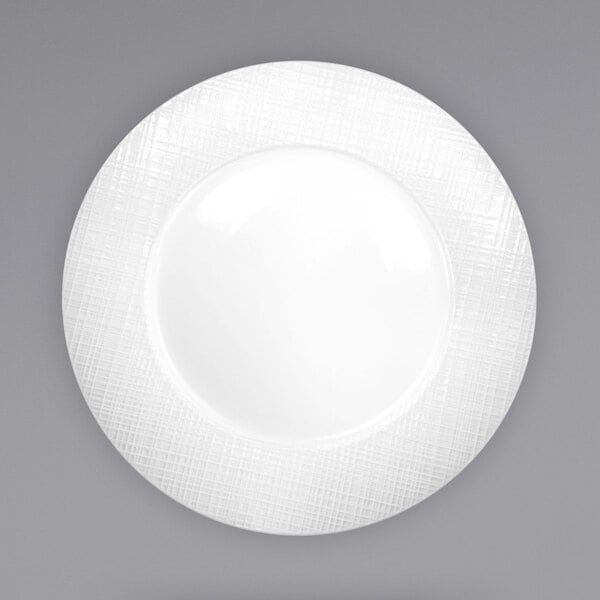 A white porcelain plate with a white rim.