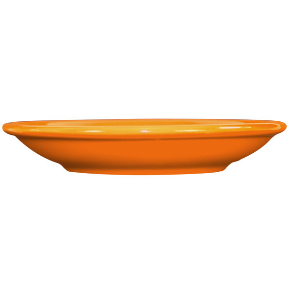 An orange International Tableware Cancun saucer on a white background.