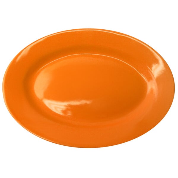 An orange International Tableware stoneware platter with a white rim.