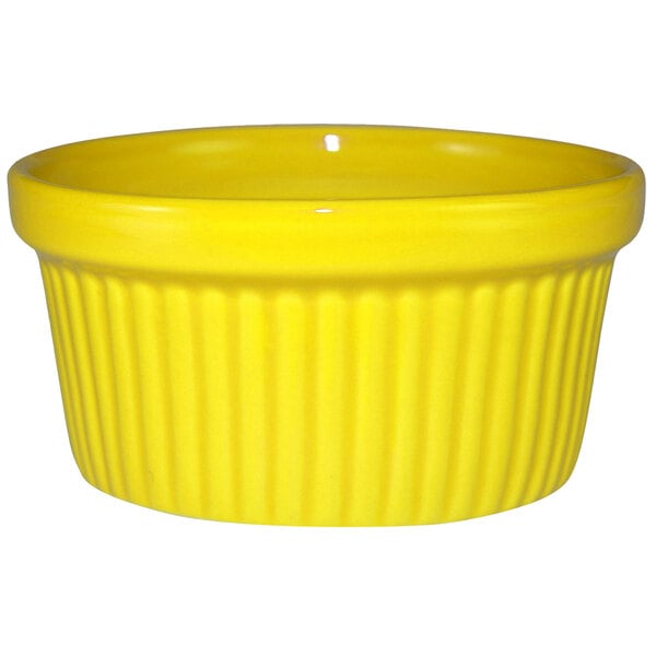 A yellow fluted stoneware ramekin.