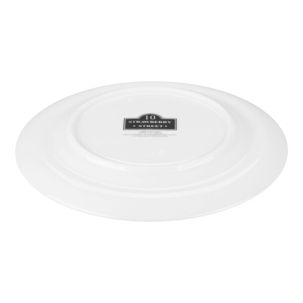 A white porcelain plate shown upside down with a label on the bottom.