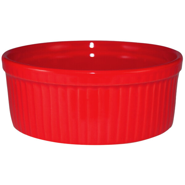 A crimson red stoneware fluted ramekin.