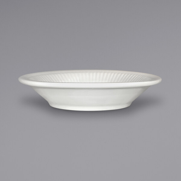 An ivory International Tableware embossed stoneware saucer.