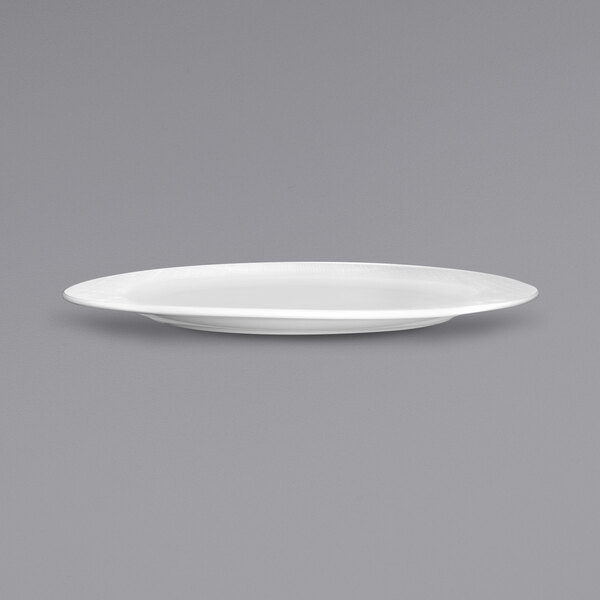A white porcelain platter with a small rim.