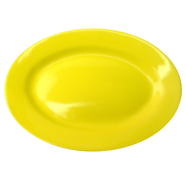 A yellow stoneware platter with a wide rim.