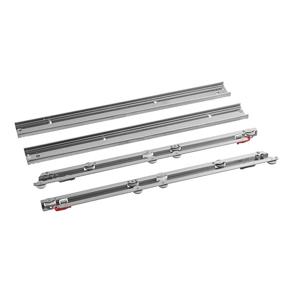 A close-up of a set of metal drawer slides with red handles.