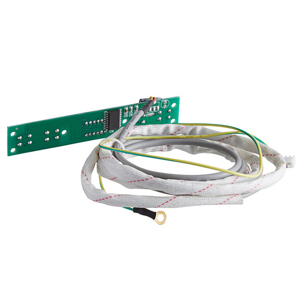 a green circuit board with wires