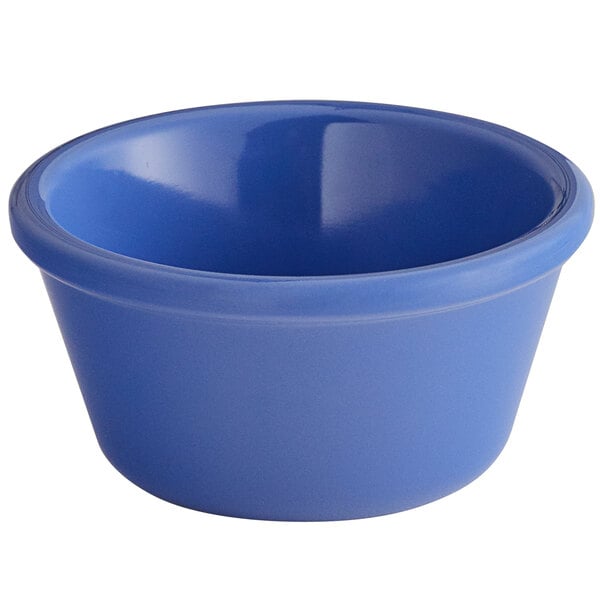A close-up of an assorted blue Elite Global Solutions ramekin.