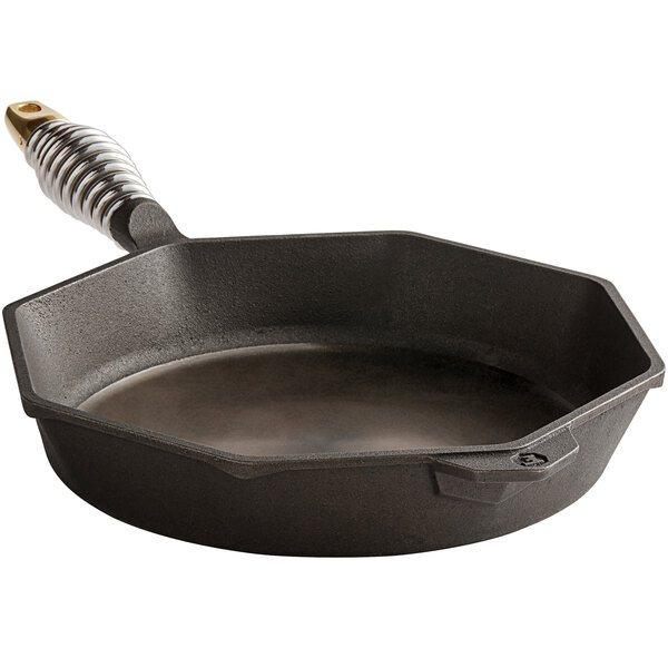 A pre-seasoned black cast iron pan with a metal handle.