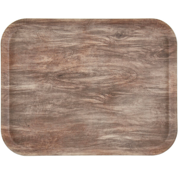 A rectangular light oak Cambro fiberglass tray with a wood surface.