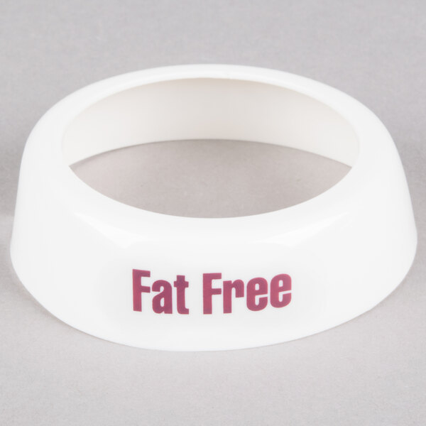 A white plastic Tablecraft salad dressing dispenser collar with red lettering reading "Fat Free"