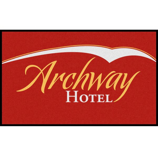 A red entrance mat with yellow text reading "Archway Hotel"