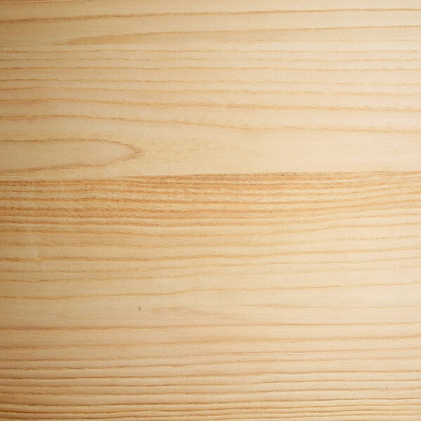 The natural wood seat of a Lancaster Table & Seating Pearl White Cafe Barstool.