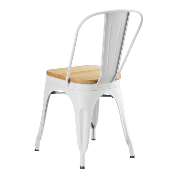 A Lancaster Table & Seating white metal cafe chair with a natural wood seat.