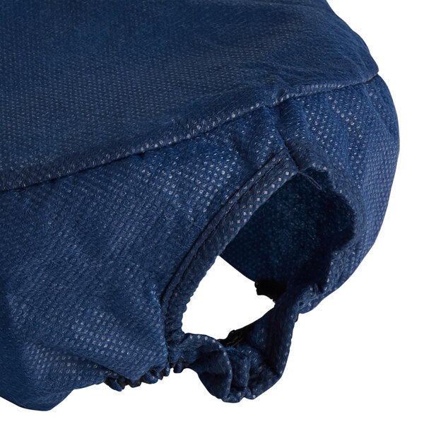 A blue bag of AmerCare Royal Navy Beanie Chef Caps with a hole in the front.