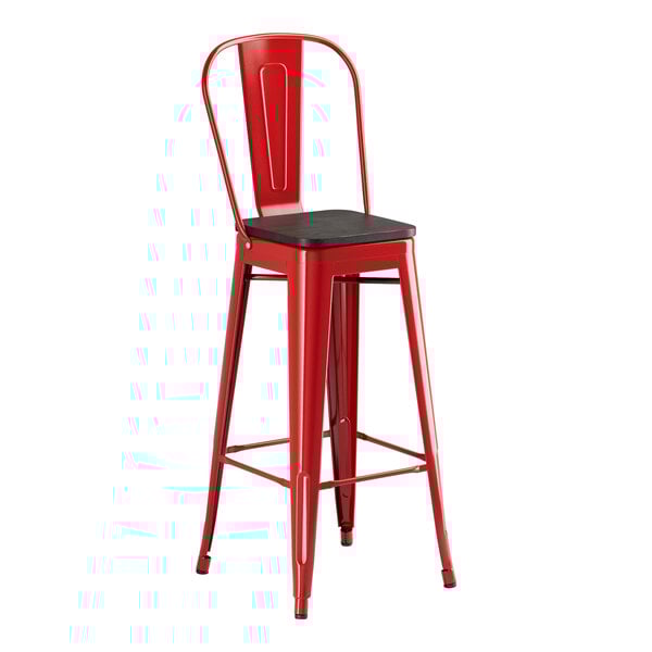 A red Lancaster Table & Seating metal barstool with a black wood seat.