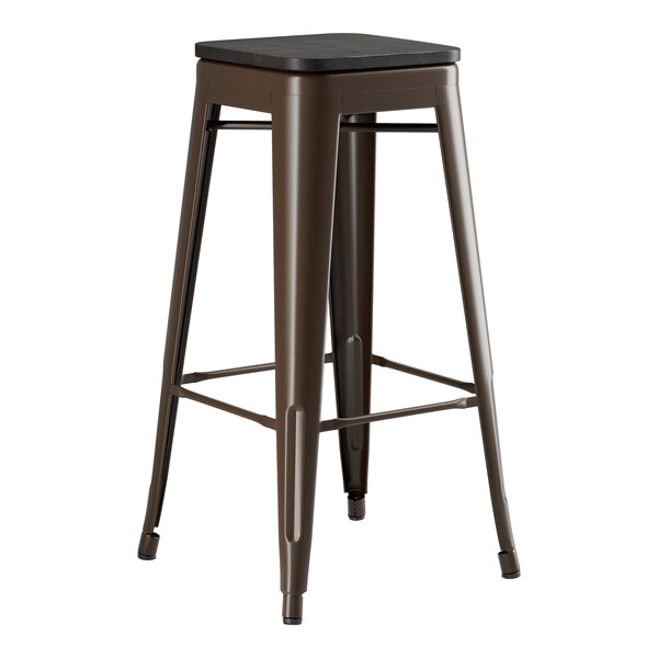 A brown Lancaster Table & Seating backless barstool with a black seat.