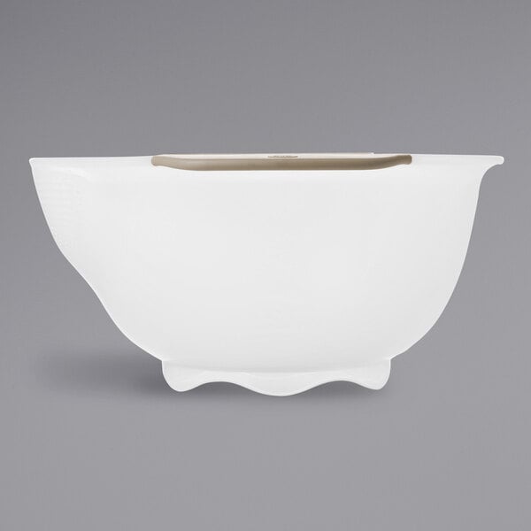 A white colander with brown handles and a base.