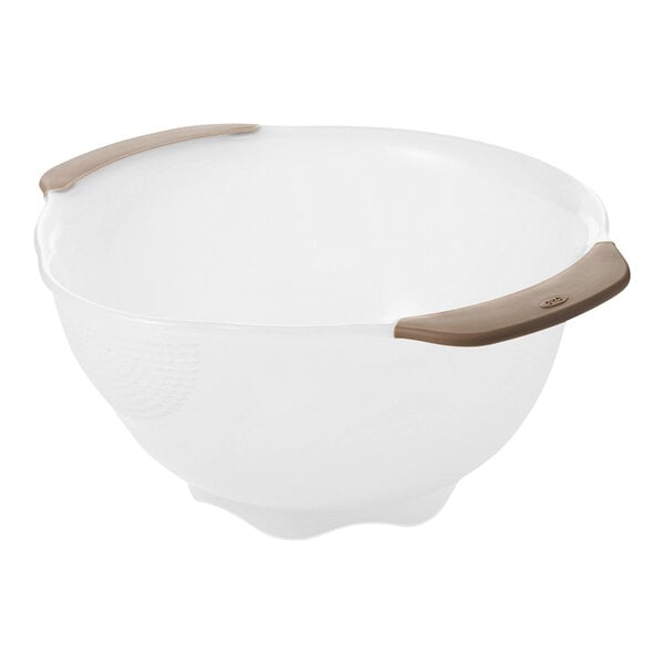A white plastic colander with a rounded base and two brown handles on opposite sides.