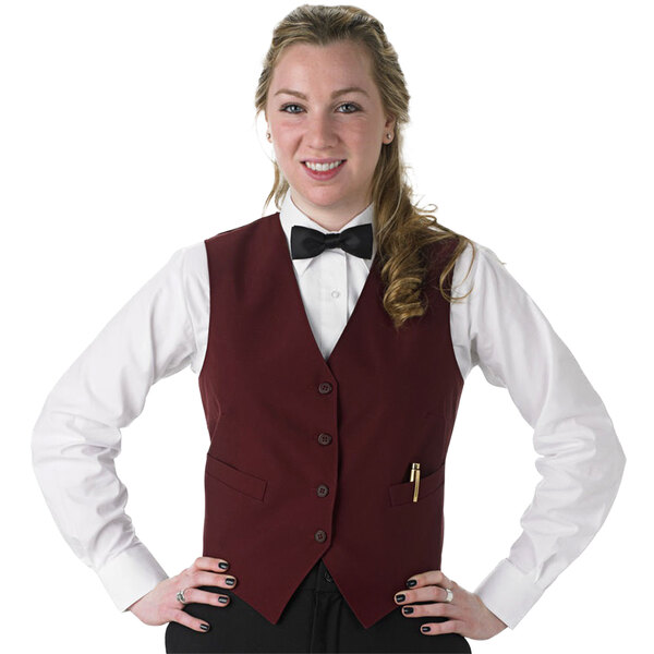 a woman in a vest and bow tie