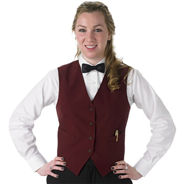 a woman in a vest and bow tie