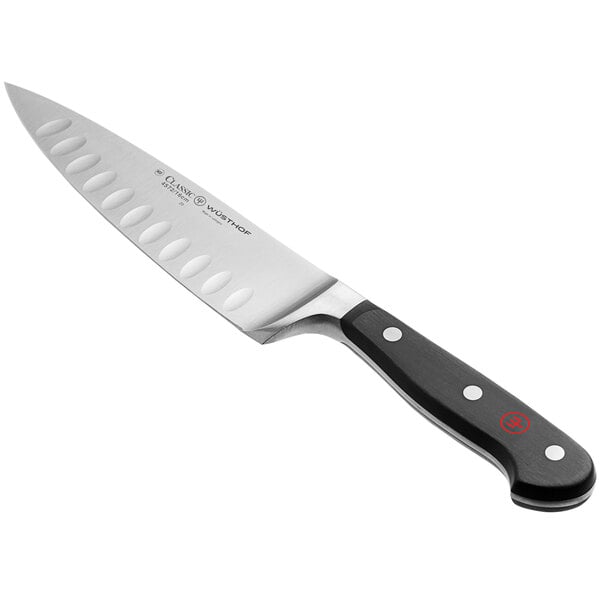 A Wusthof Classic forged cook's knife with a black handle.
