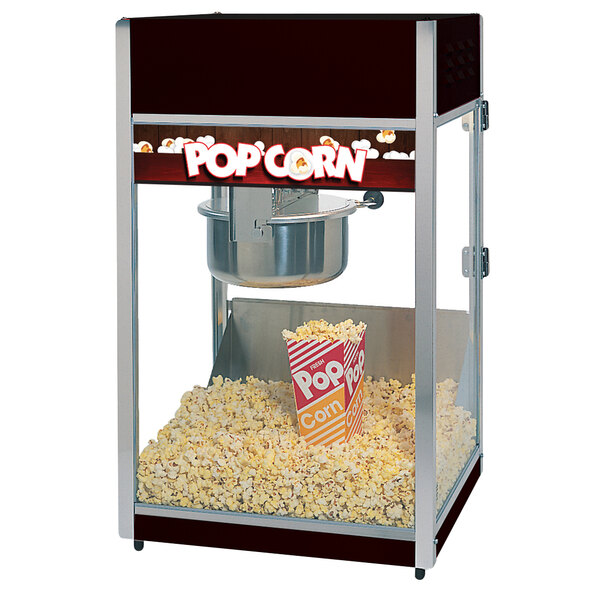 A Global Solutions by Nemco popcorn machine with a bowl of popcorn.
