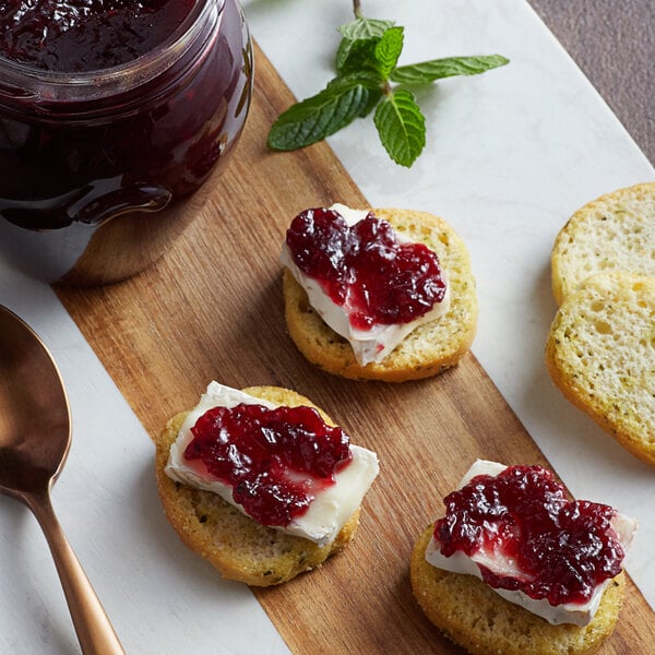 A piece of bread with Dalmatia Organic Blackberry Spread on top.