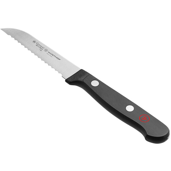a knife with a black handle