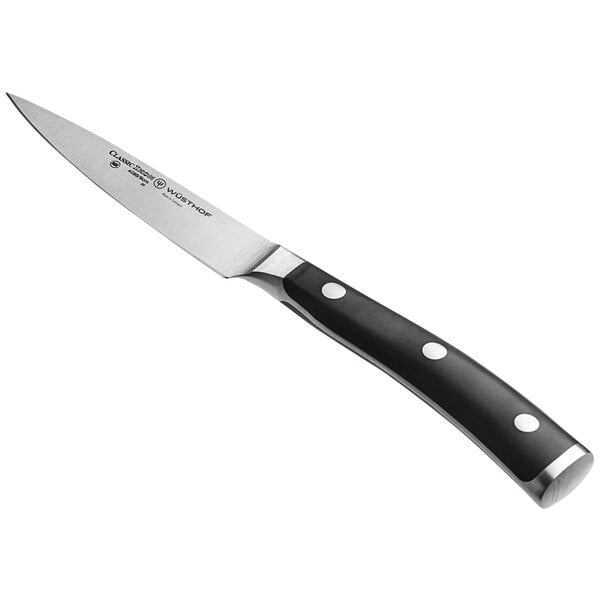 A Wusthof Classic Ikon forged paring knife with a black handle.