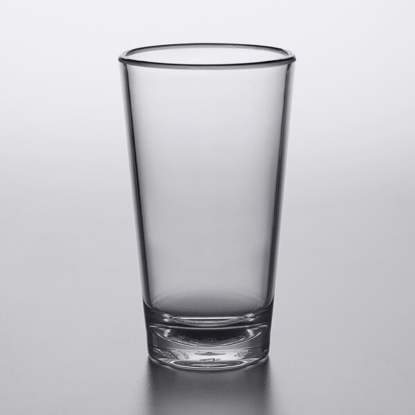 A clear Carlisle plastic mixing glass.